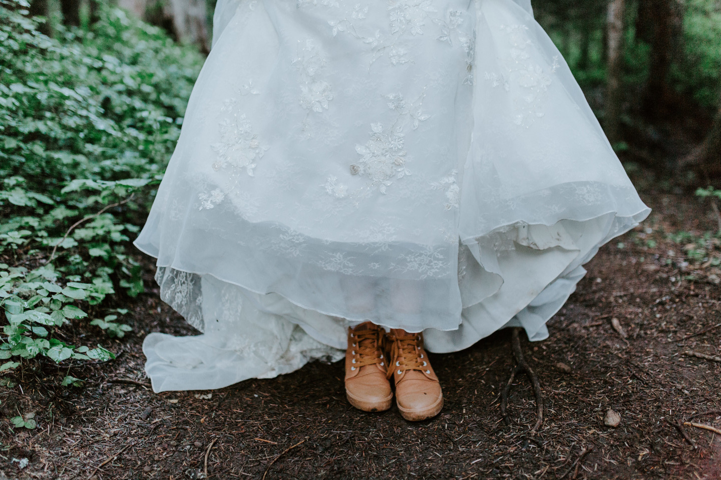 Moira shows off her adventure shoes. Adventure elopement wedding shoot by Sienna Plus Josh.
