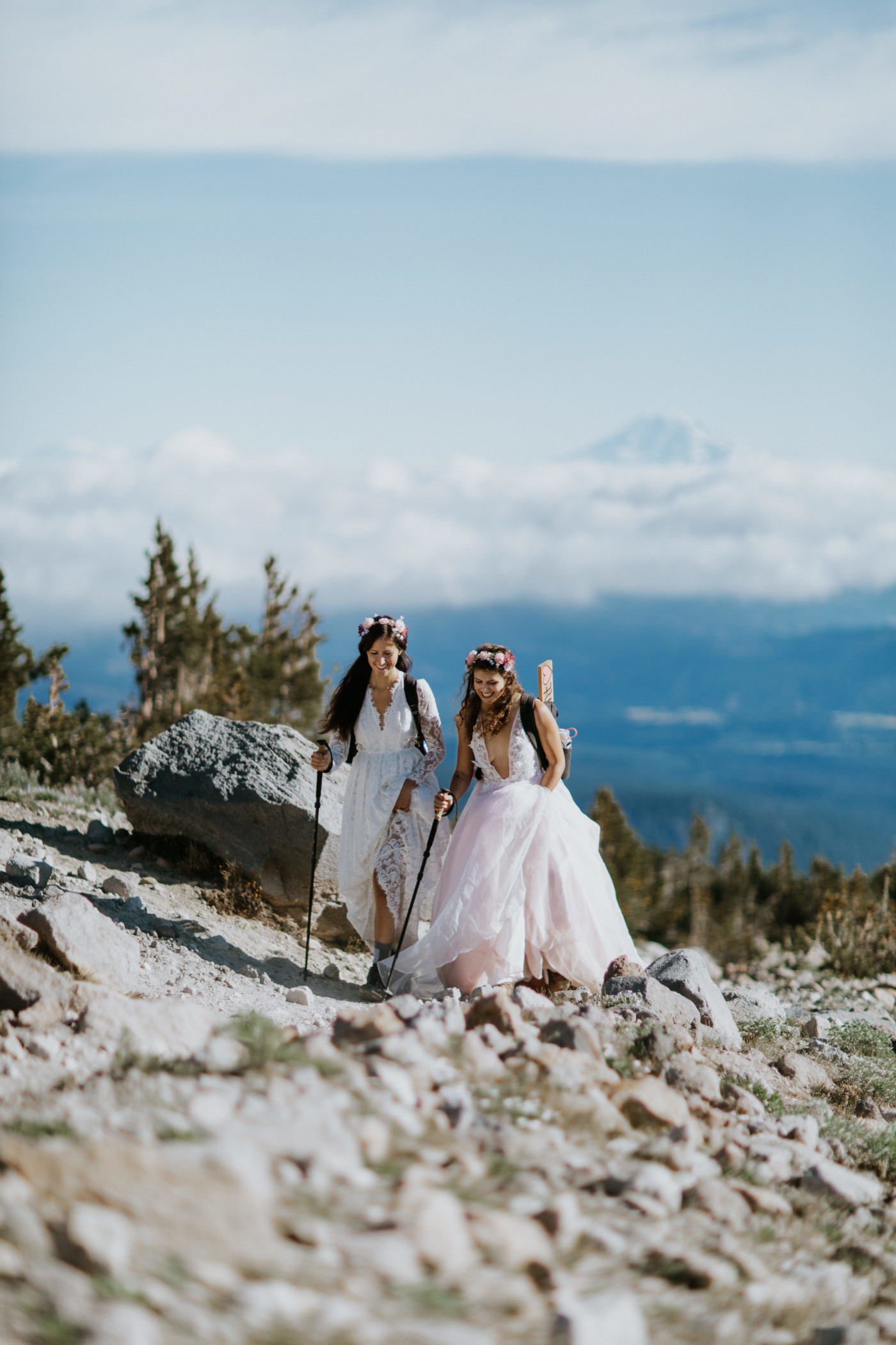 Heather and Margaux trekking along the trail. Elopement photography at Mount Hood by Sienna Plus Josh.