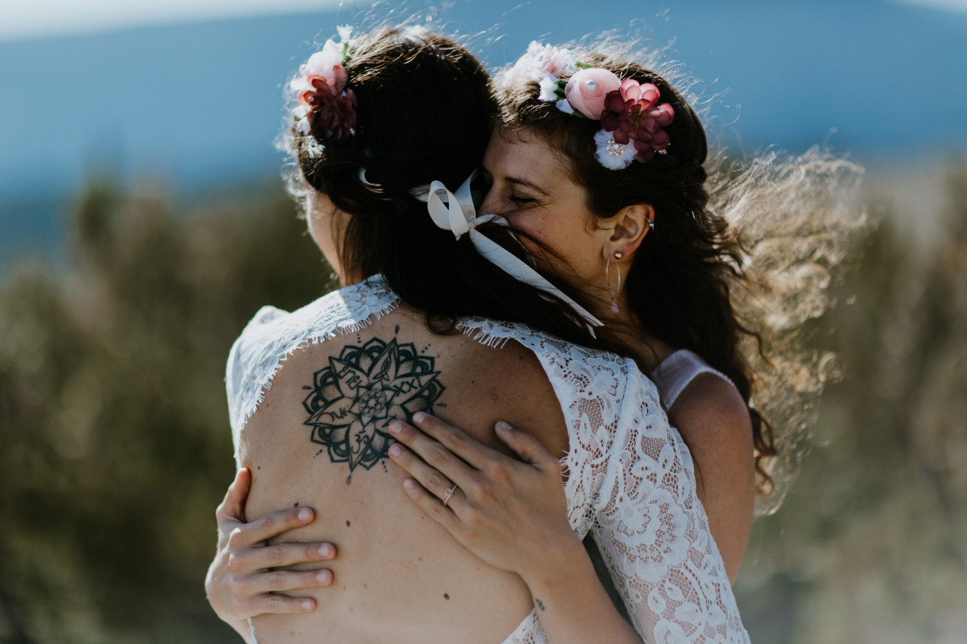 Margaux and Heather hug. Elopement photography at Mount Hood by Sienna Plus Josh.