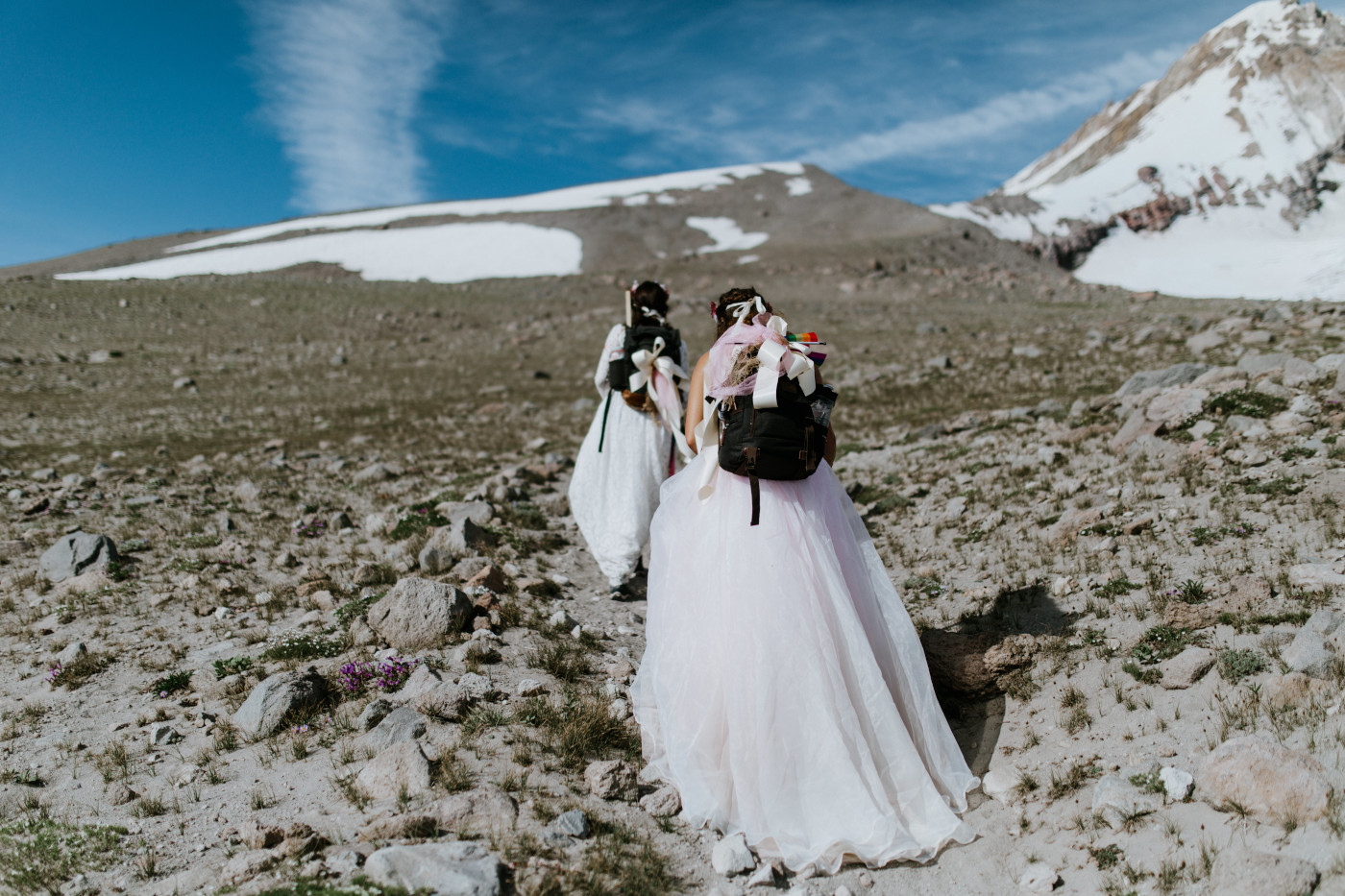 Heather and Margaux hike up the side of Mount Hood. Elopement photography at Mount Hood by Sienna Plus Josh.