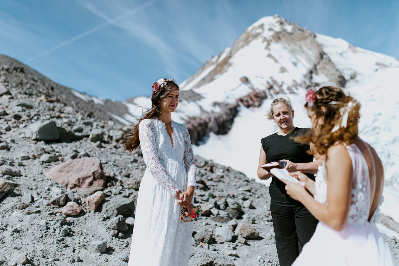 Margaux listens to Heather during their elopement. Elopement photography at Mount Hood by Sienna Plus Josh.