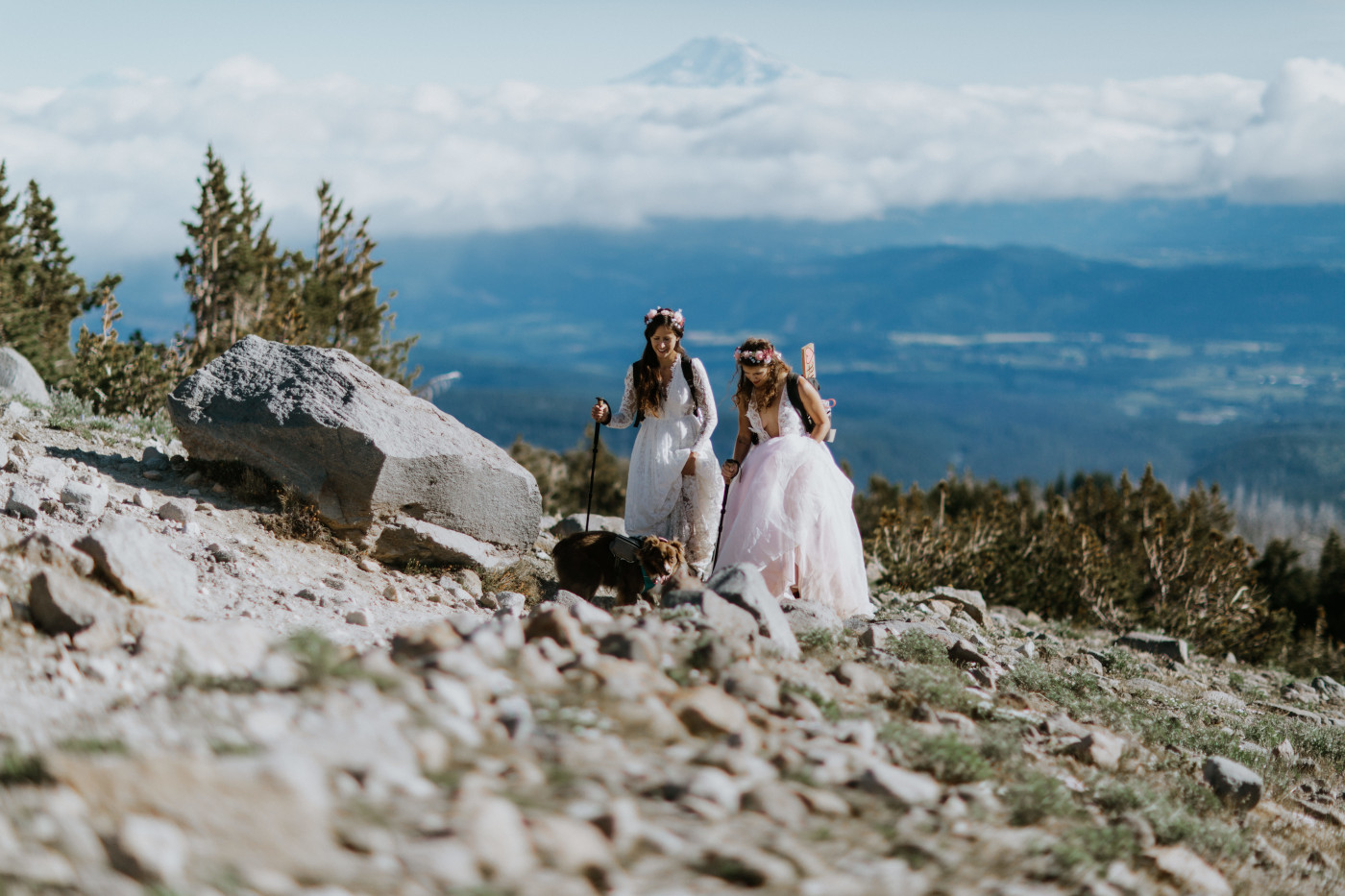 Margaux and Heather hike up the rocky side of Mount Hood. Elopement photography at Mount Hood by Sienna Plus Josh.