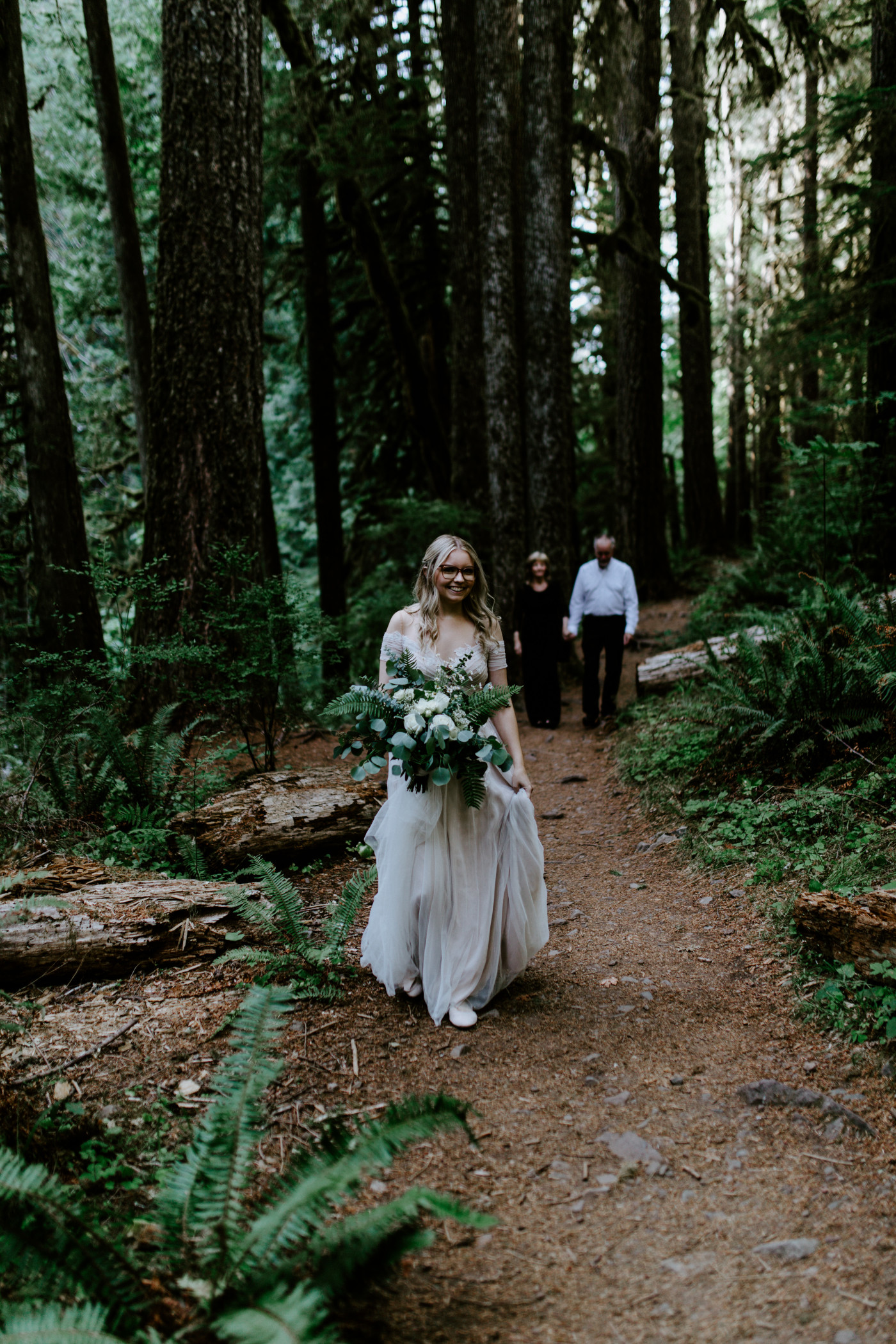 Kylie walks through the woods of Mount Hoods to her ceremony spot.