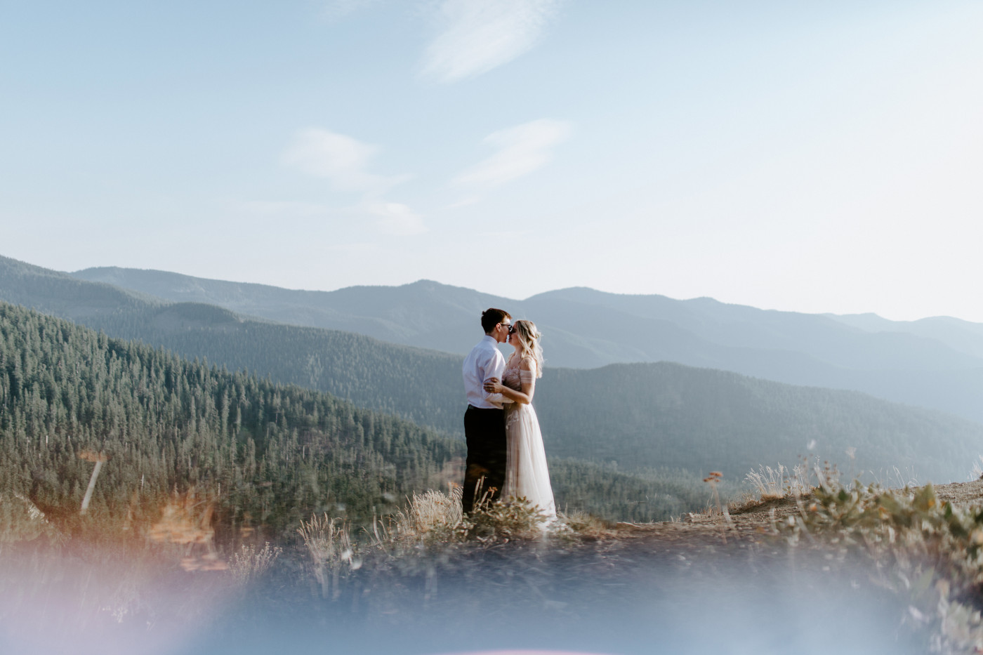 Kylie and Corey stand in the Mount Hood National Forest after their elopement.