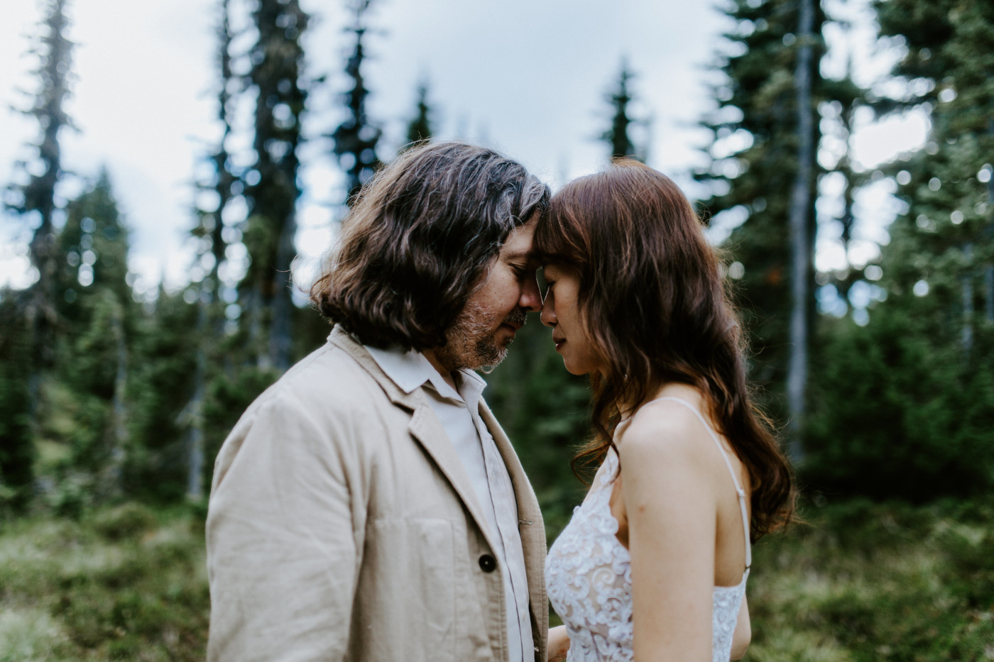 Katrina and Matthew stand head to head at Mount Rainier during their elopement.