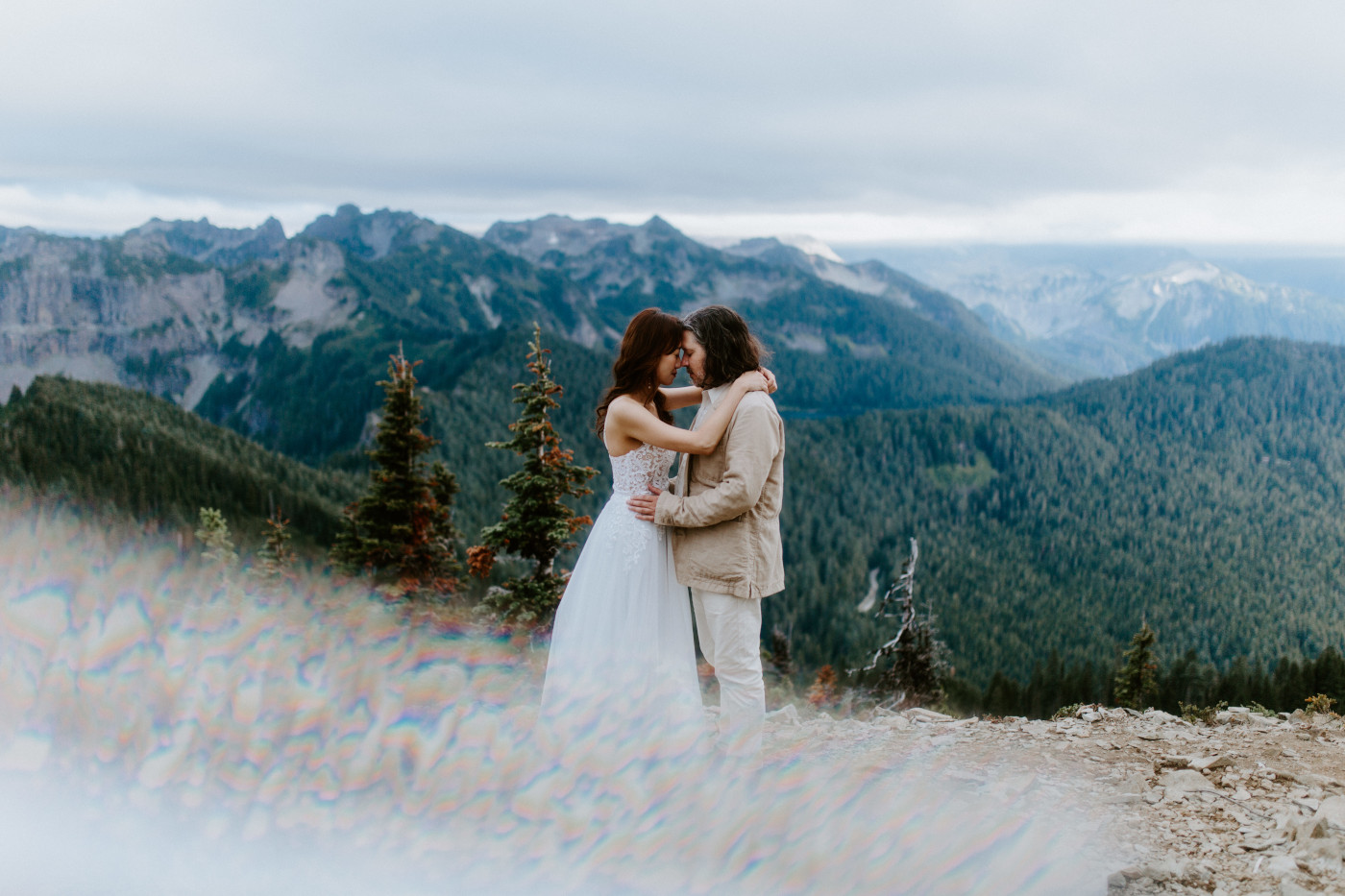 Katrina and Matthew stand head to head at Mount Rainier after their elopement.