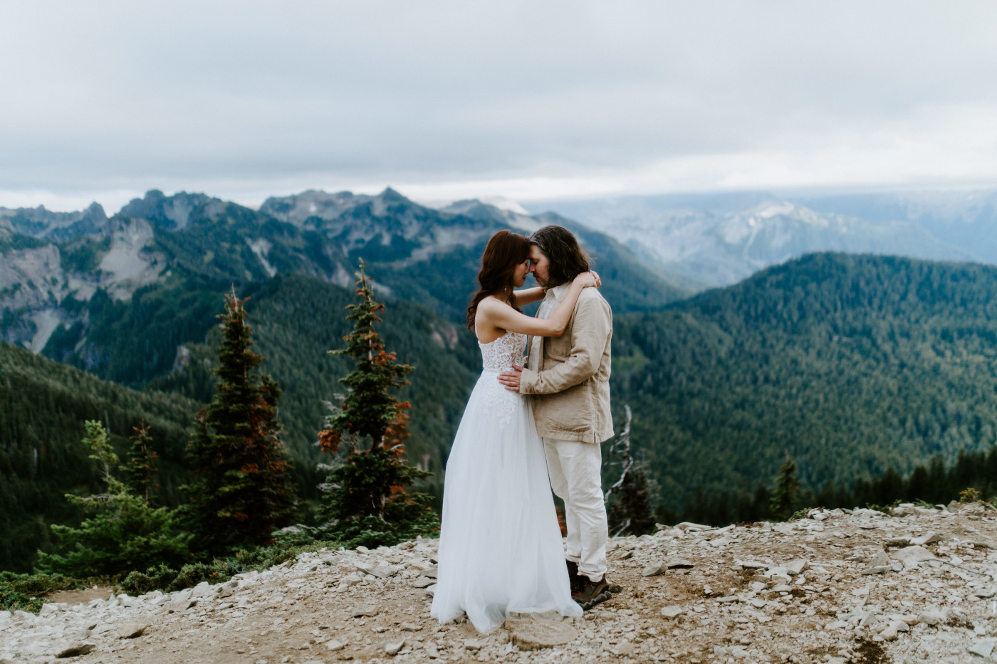 Katrina and Matthew stand head to head at Mount Rainier during their elopement.