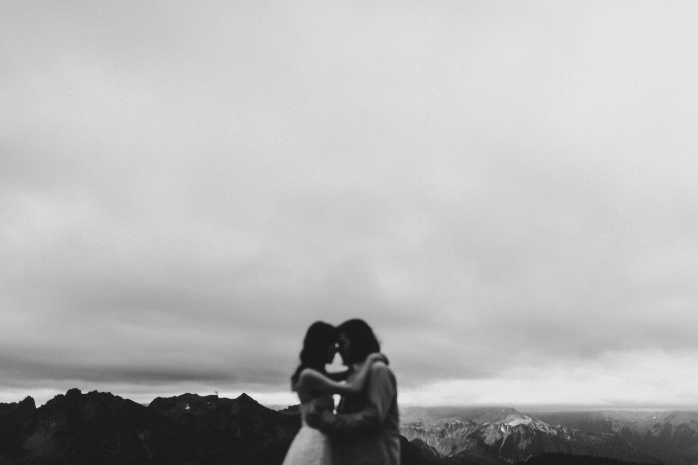 Matthew and Katrina stand head to head at Mount Rainier during their elopement.