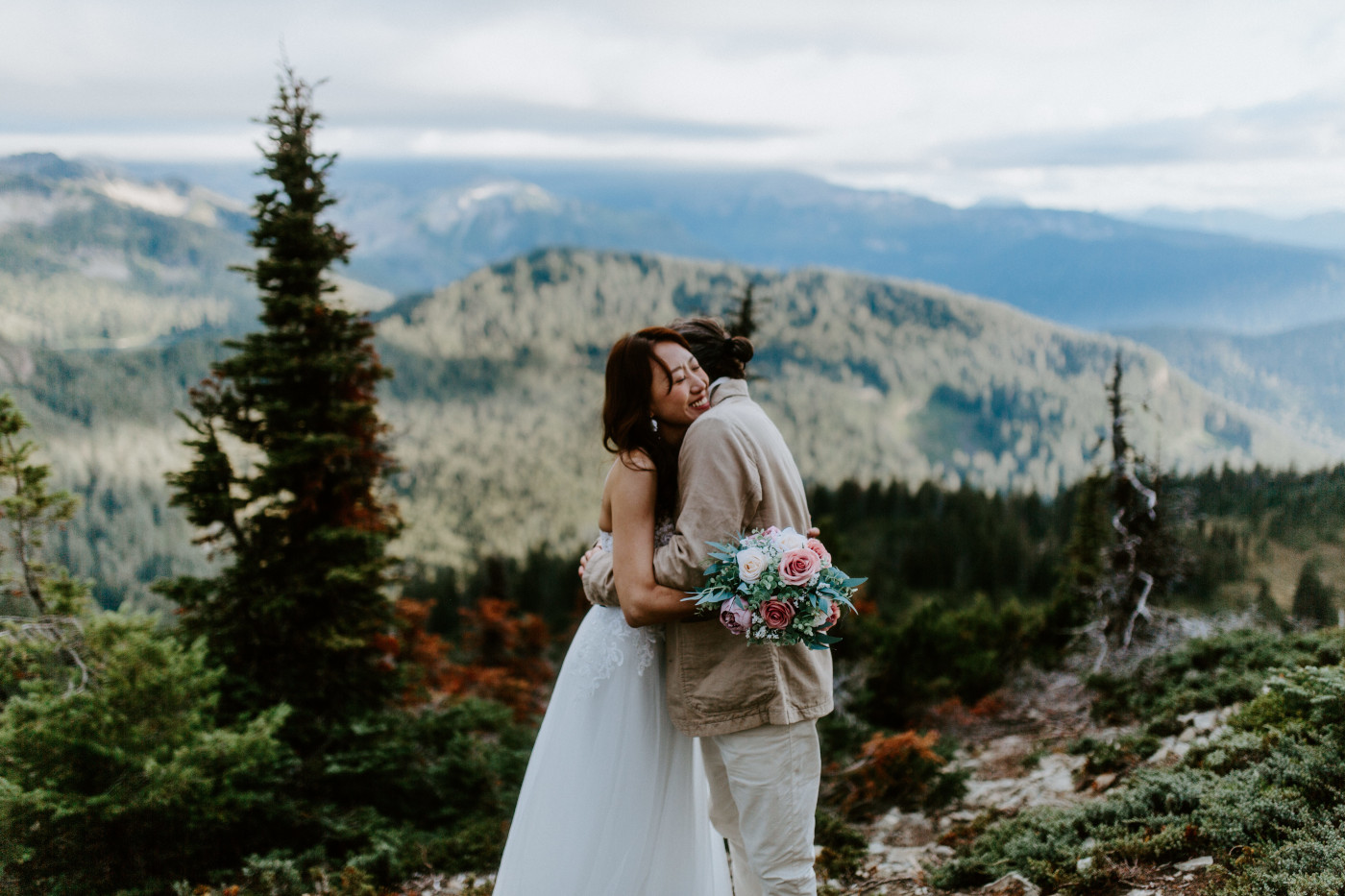 Katrina hugs Matthew after their elopement at Mount Rainier, Washington.