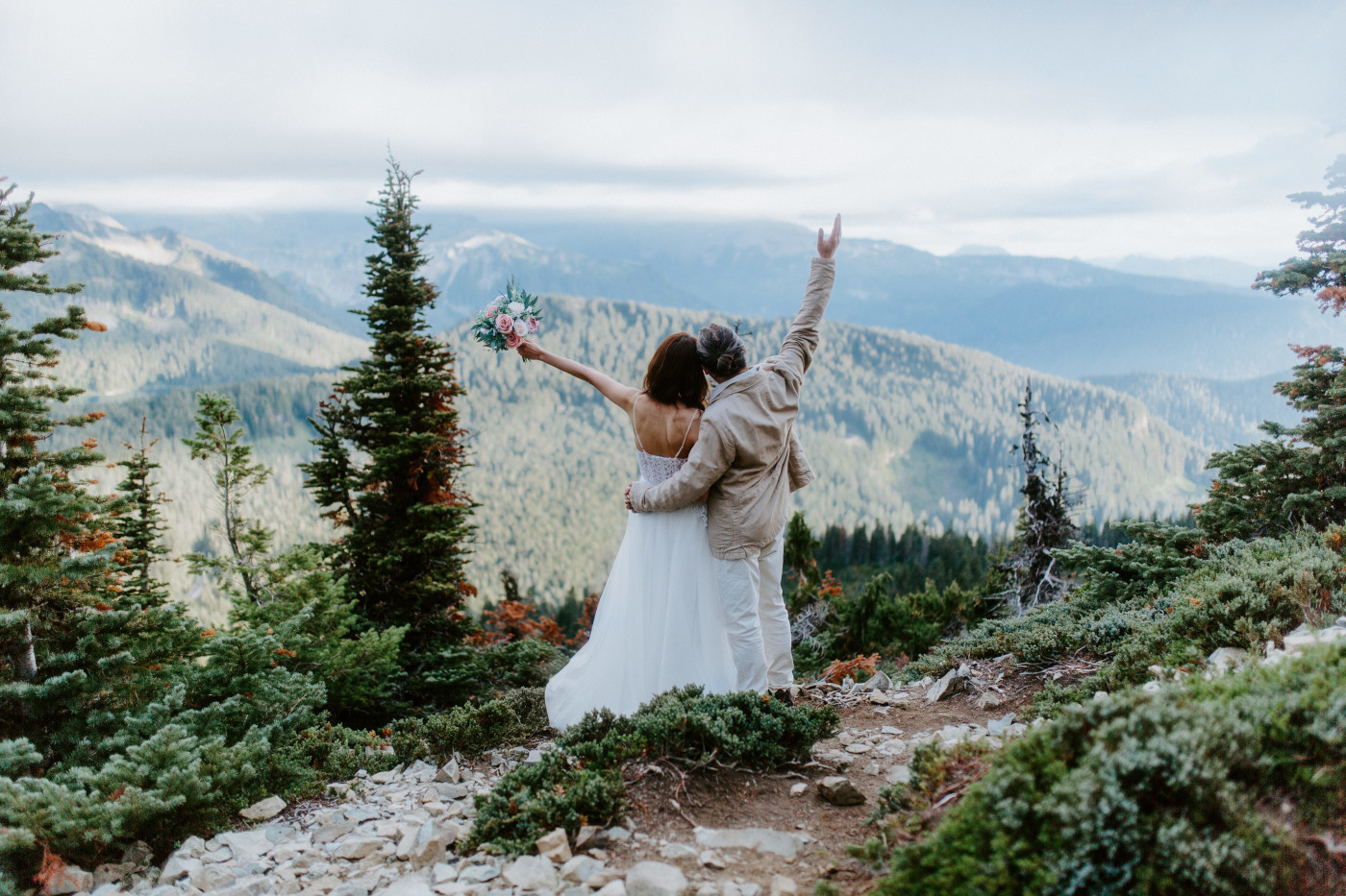 Katrina and Matthew celebrate after their elopement at Mount Rainier, Washington.