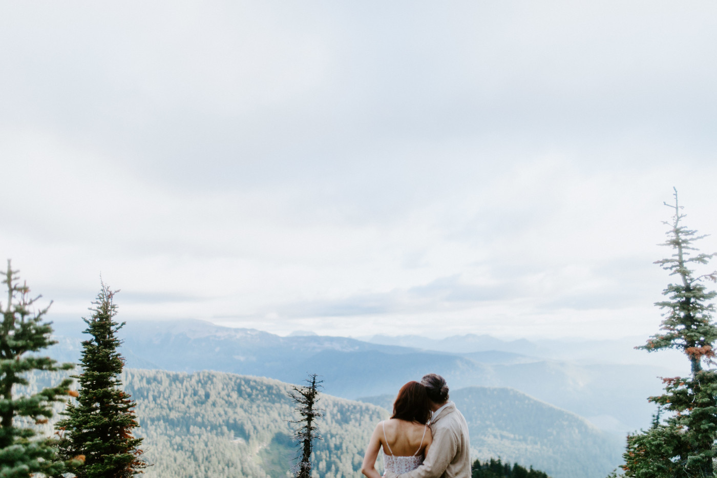 Katrina and Matthew enjoy the view at Mount Rainier after their elopement.