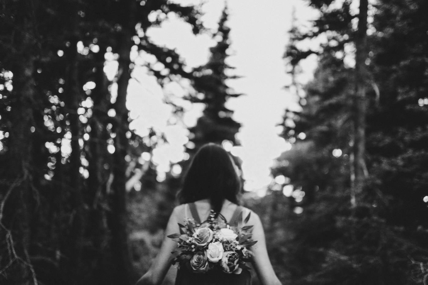 Katrina walks down the path after her elopement at Mount Rainier, Washington.