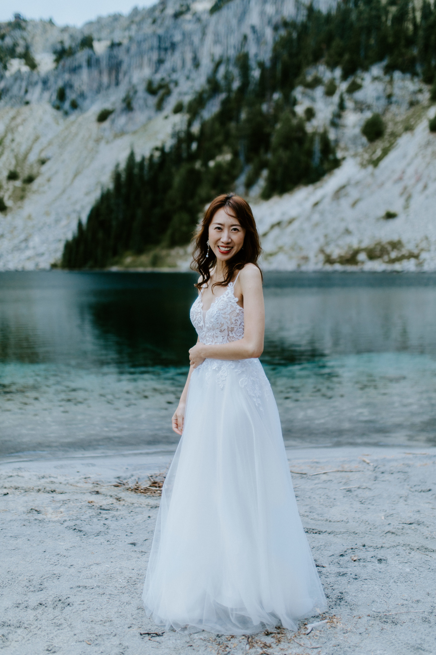 Katrina stand alone during her elopement at Mount Rainier in Washington.