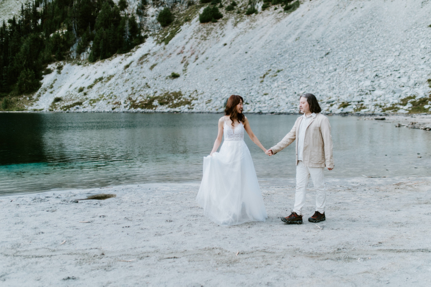 Matthew and Katrina walk hand in hand at Mount Rainier after their elopement.