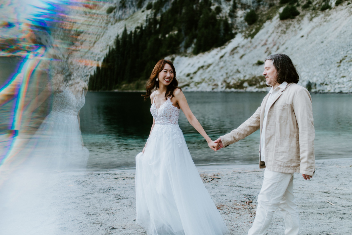 Katrina and Matthew hold hands as they walk during their Mount Rainier elopement.