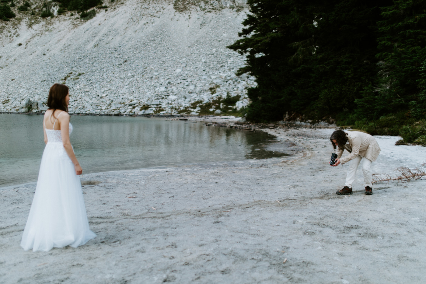 Matthew takes pictures of Katrina at Mount Rainier after their elopement ceremony.