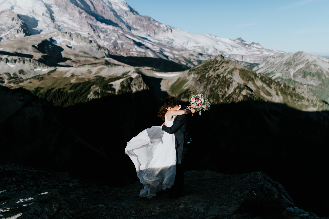 Chad and Tasha with a view of the mountain behind them. Elopement photography at Mount Rainier by Sienna Plus Josh.