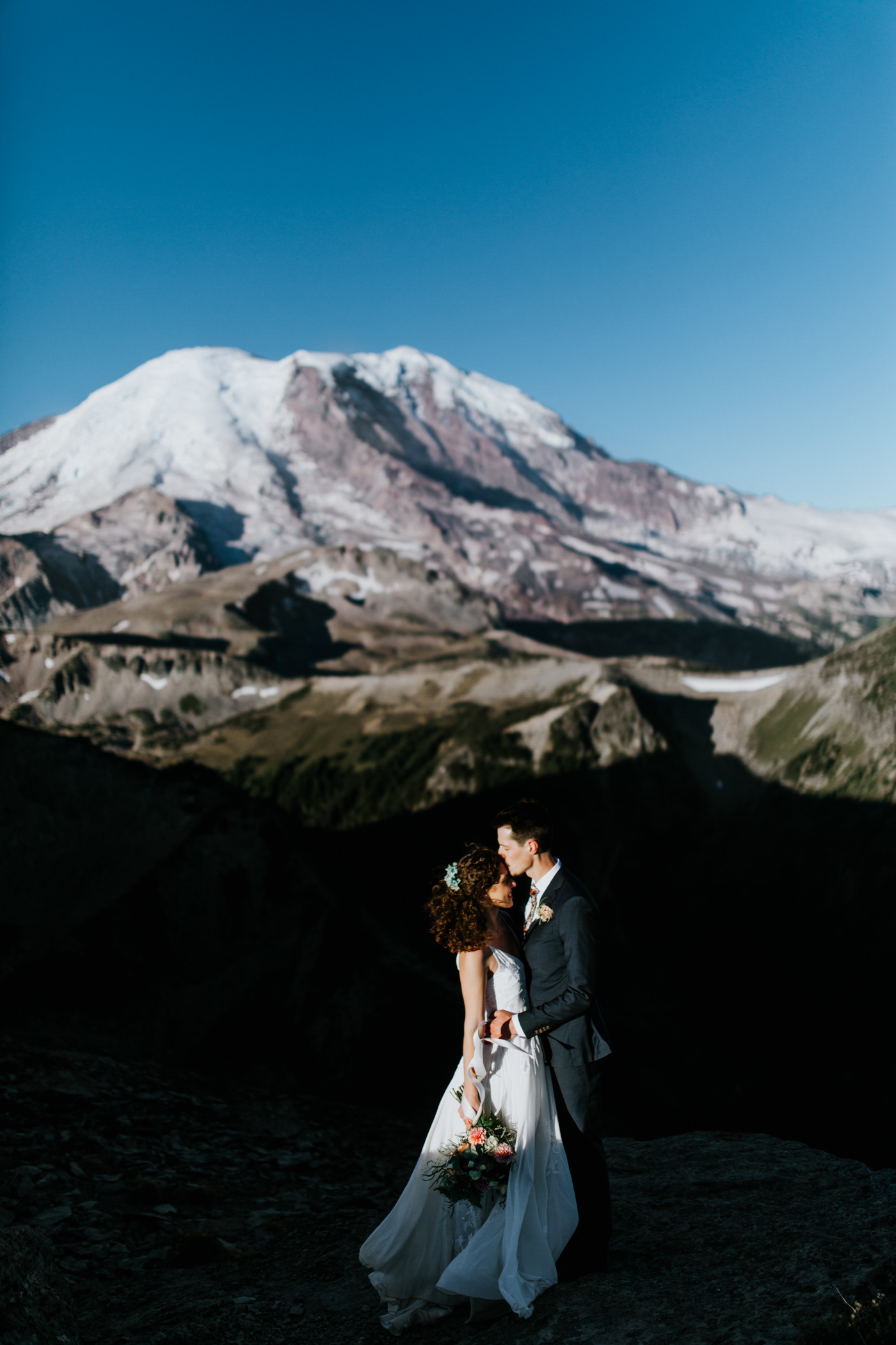 Chad and Tasha kiss. Elopement photography at Mount Rainier by Sienna Plus Josh.
