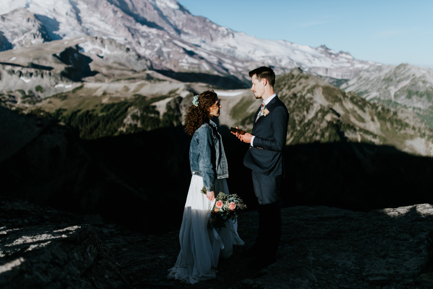 Chad and Tasha read vows. Elopement photography at Mount Rainier by Sienna Plus Josh.