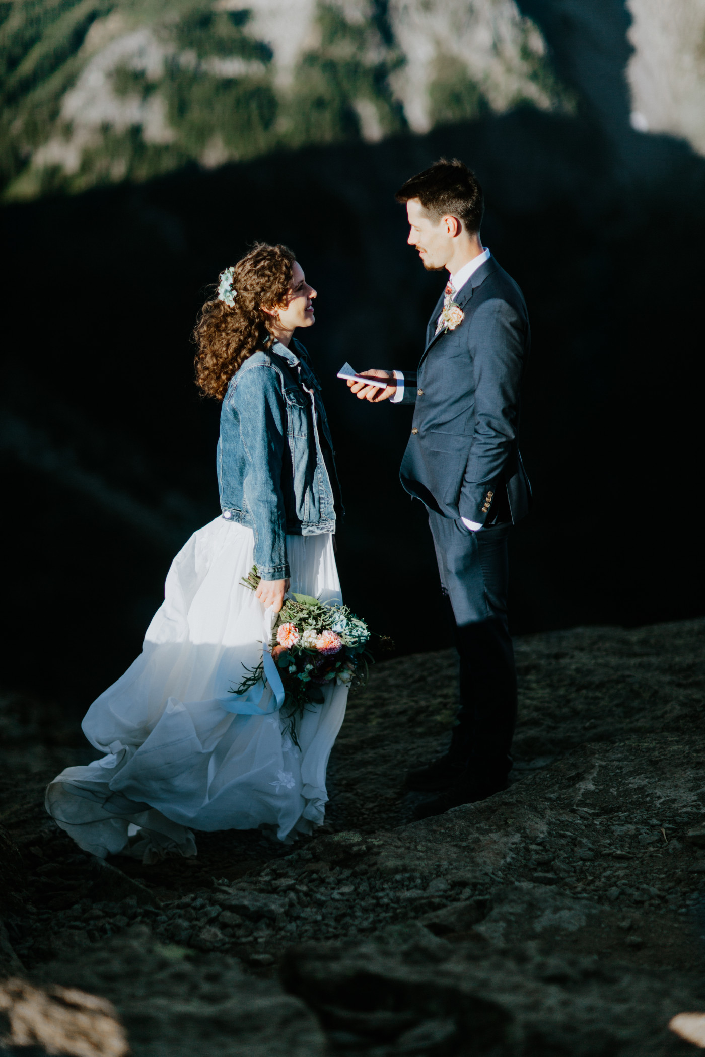 Tasha and Chad standing during their elopement ceremony. Elopement photography at Mount Rainier by Sienna Plus Josh.
