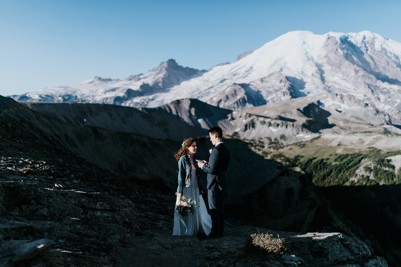 Tash and Chad standing with the mountain in the background. Elopement photography at Mount Rainier by Sienna Plus Josh.