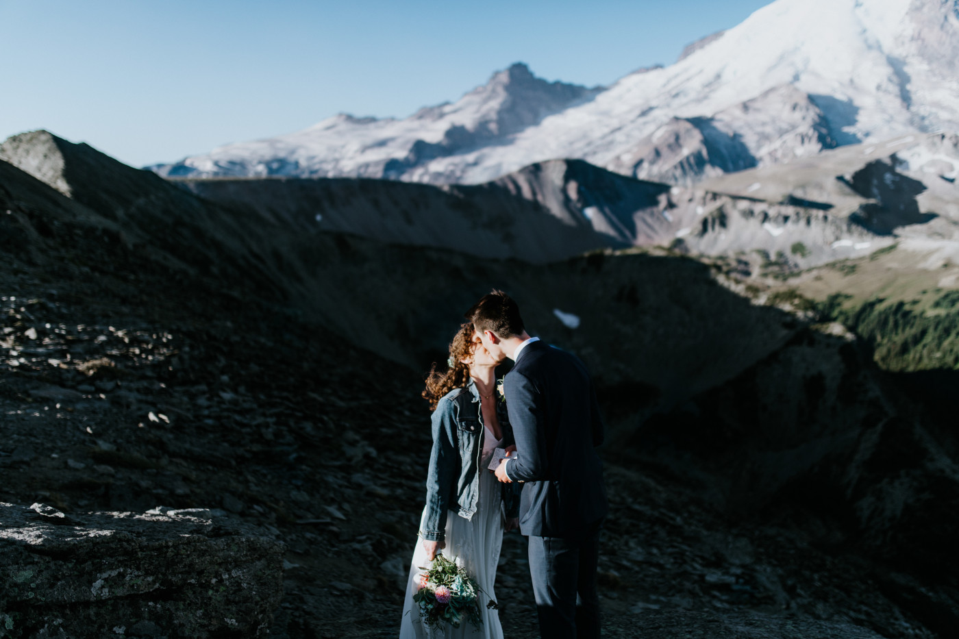 Chad and Tasha kiss. Elopement photography at Mount Rainier by Sienna Plus Josh.