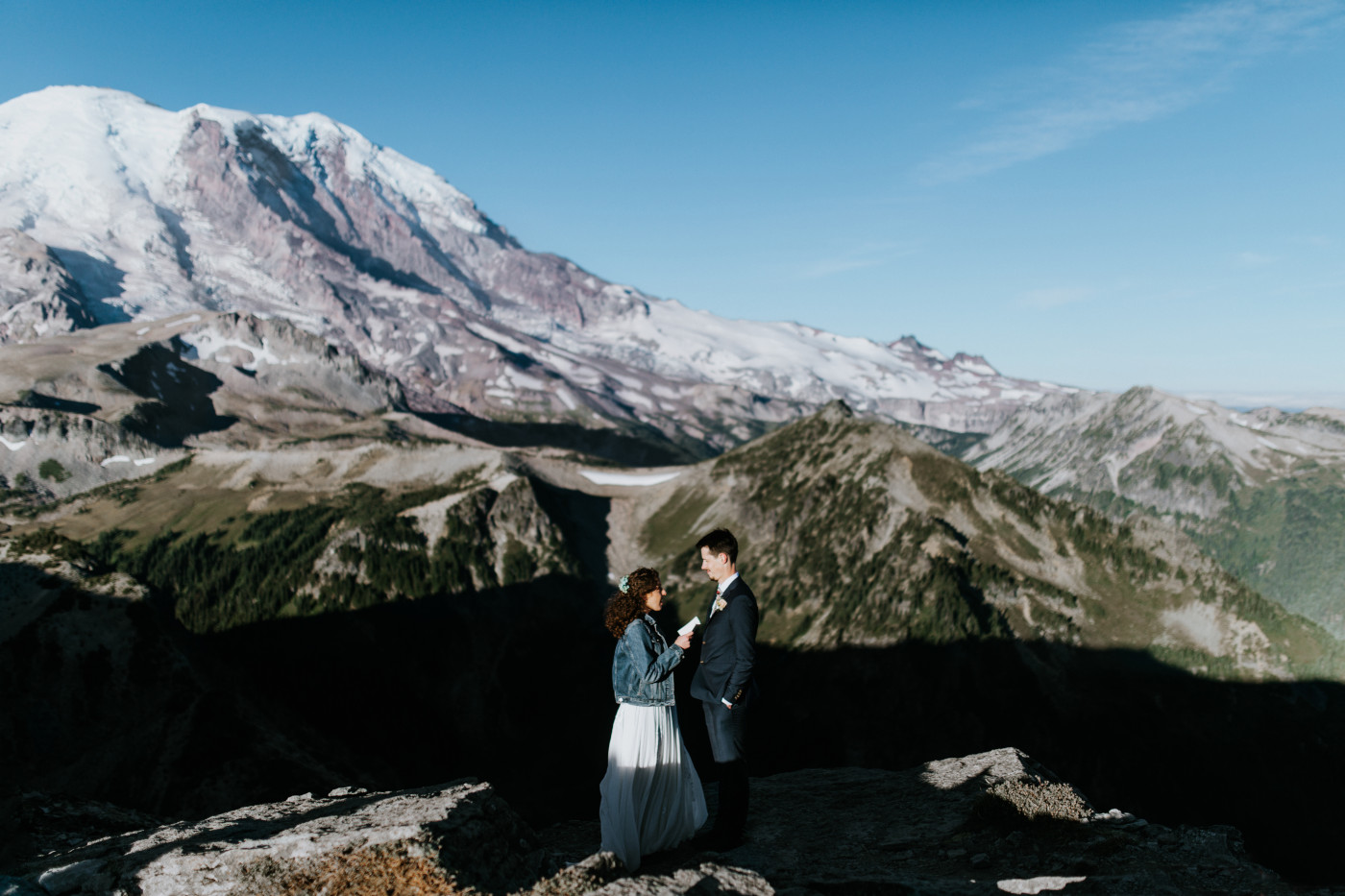 Chad and Tasha reciting vows at their elopement spot. Elopement photography at Mount Rainier by Sienna Plus Josh.