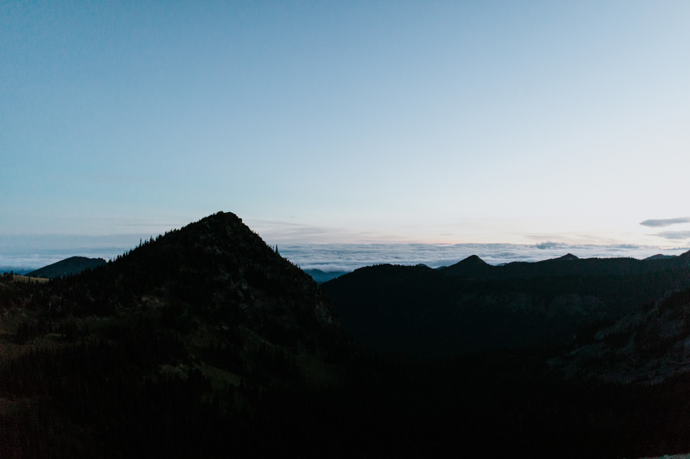A view of the sunrise over the mountains. Elopement photography at Mount Rainier by Sienna Plus Josh.