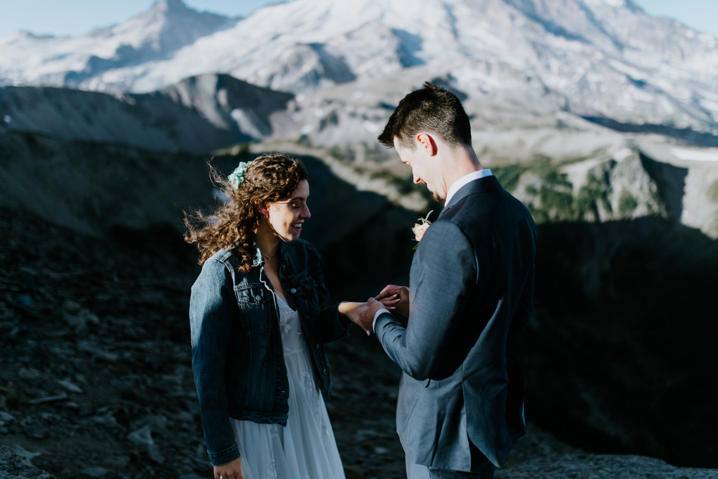 Tasha and Chad exchange rings. Elopement photography at Mount Rainier by Sienna Plus Josh.