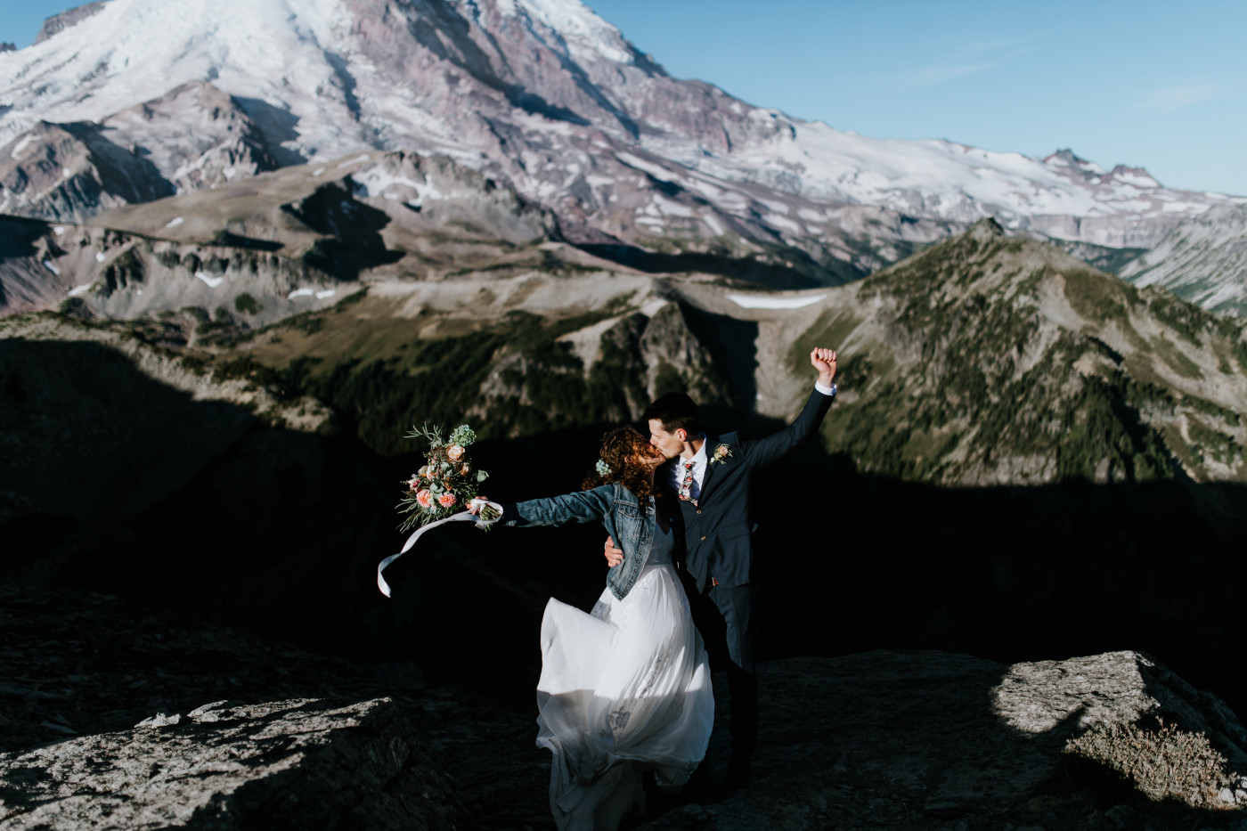 Tasha and Chad kiss while celebrating. Elopement photography at Mount Rainier by Sienna Plus Josh.