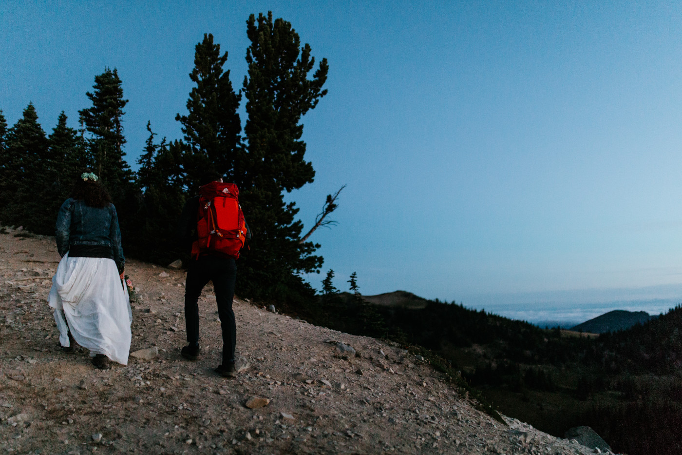 Tasha and Chad hiking. Elopement photography at Mount Rainier by Sienna Plus Josh.