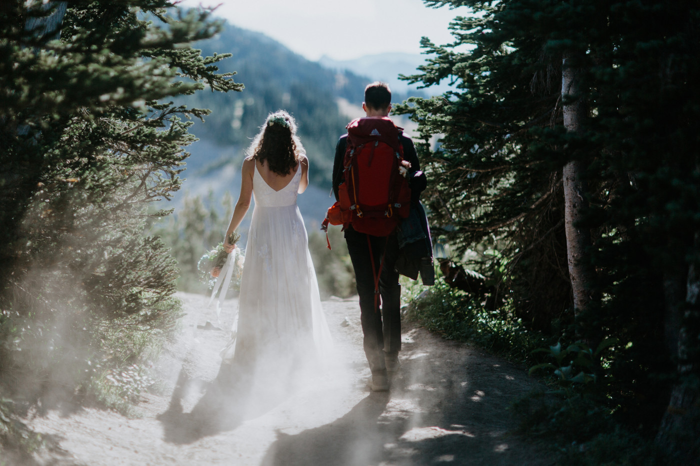 Tasha and Chad walk through the woods. Elopement photography at Mount Rainier by Sienna Plus Josh.