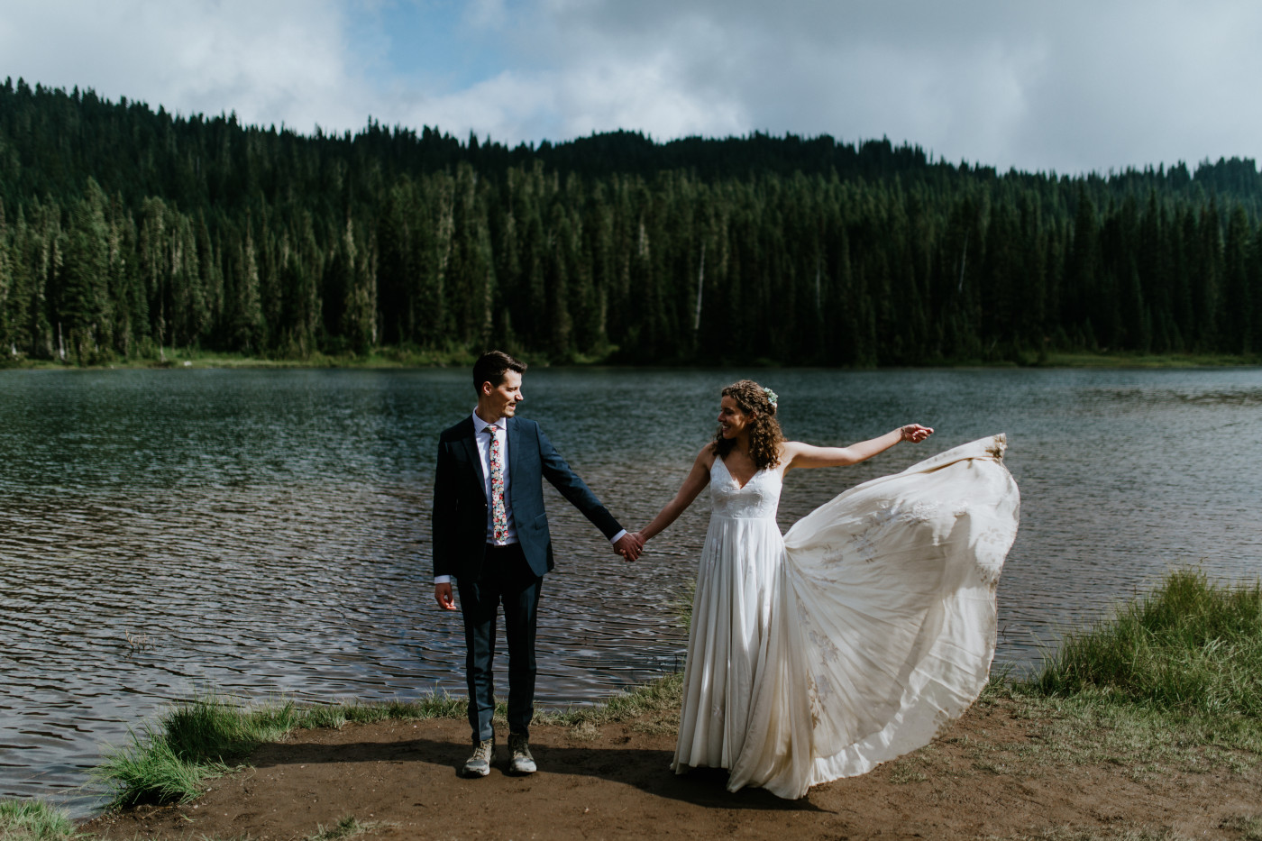 Tasha and Chad stand together in front of the lake. Elopement photography at Mount Rainier by Sienna Plus Josh.