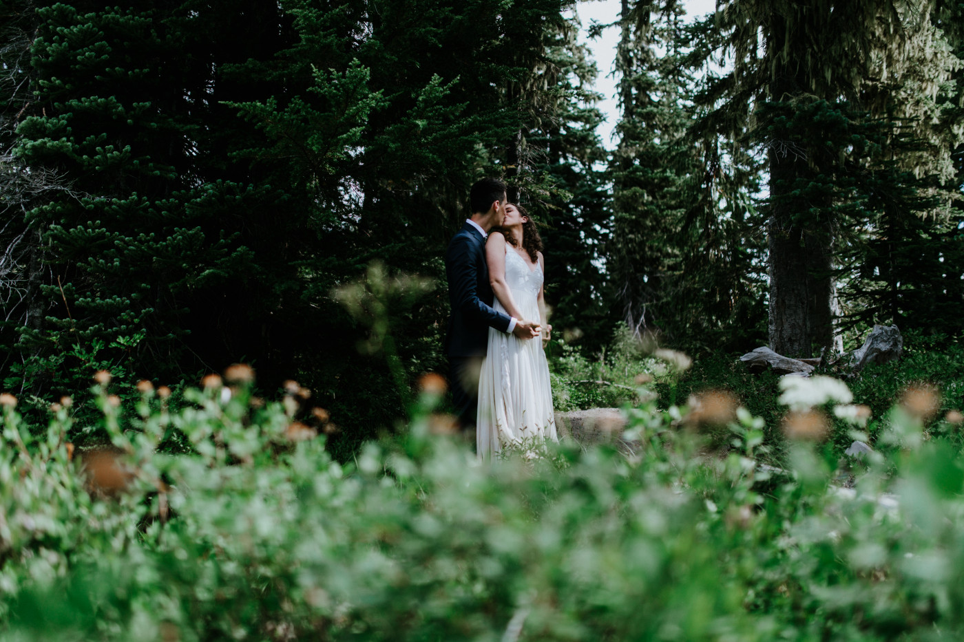 Tasha and Chad kiss. Elopement photography at Mount Rainier by Sienna Plus Josh.