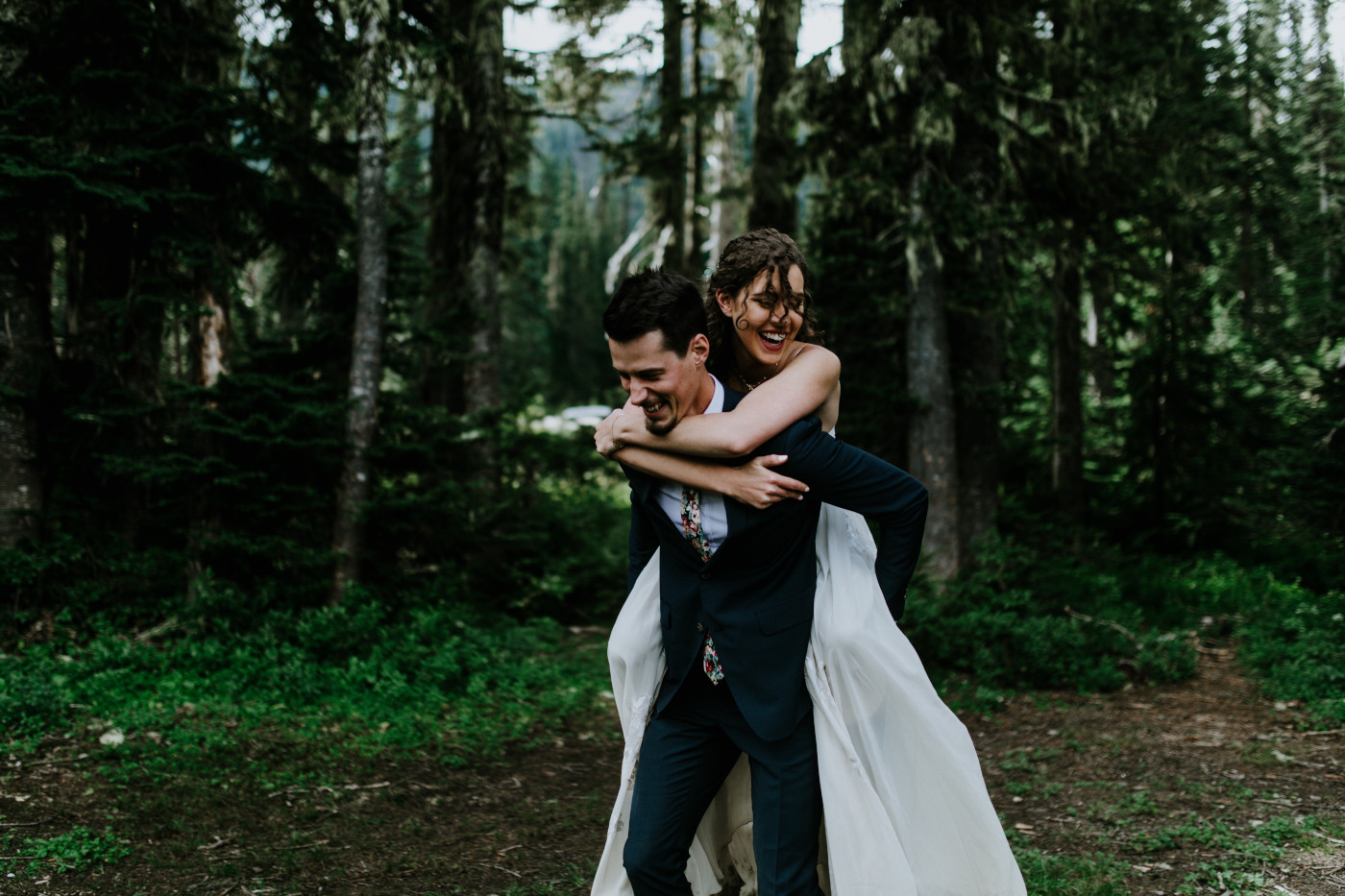 Chad and Tasha play in the woods. Elopement photography at Mount Rainier by Sienna Plus Josh.