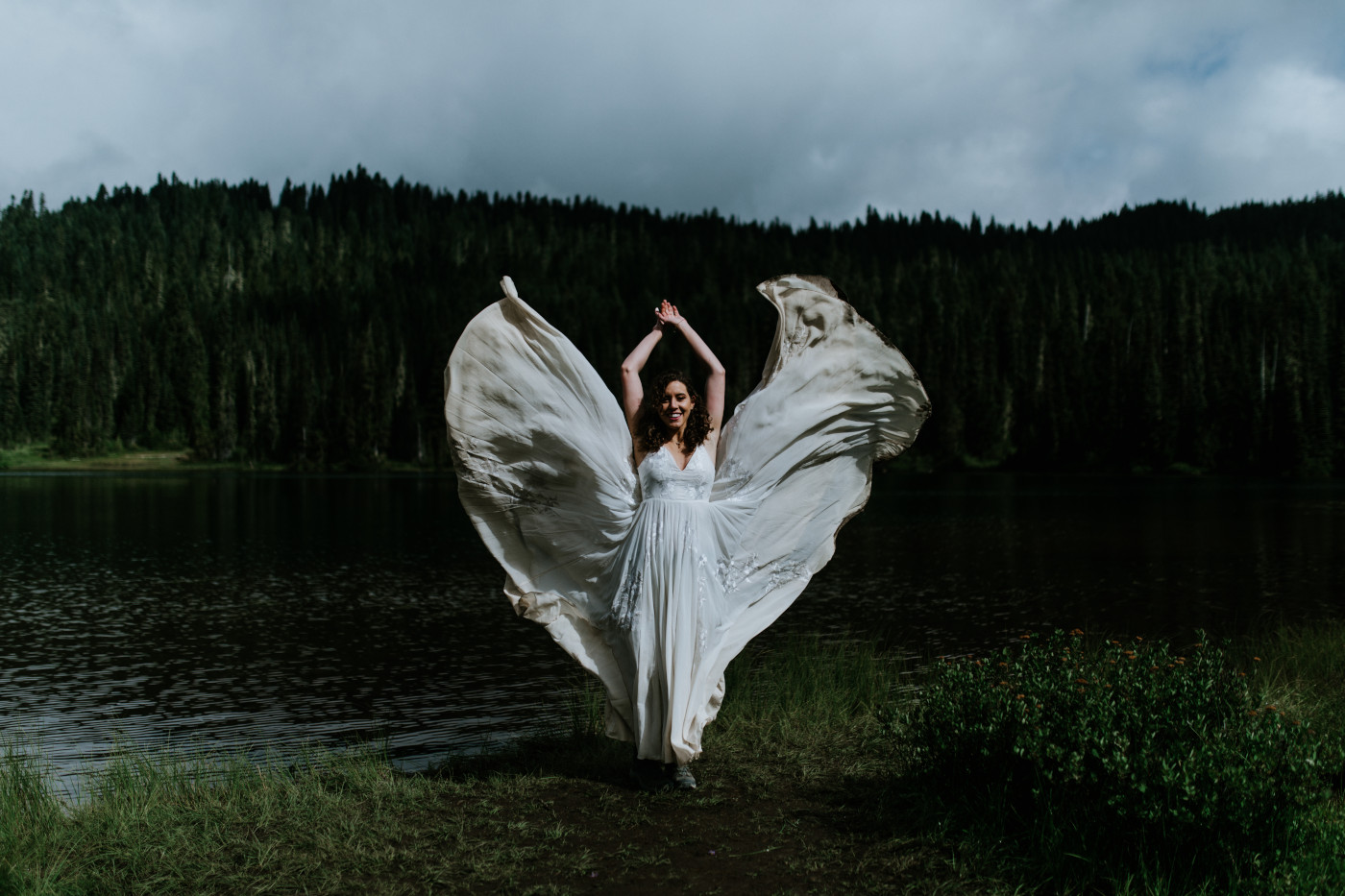 Tasha throws out her dress. Elopement photography at Mount Rainier by Sienna Plus Josh.