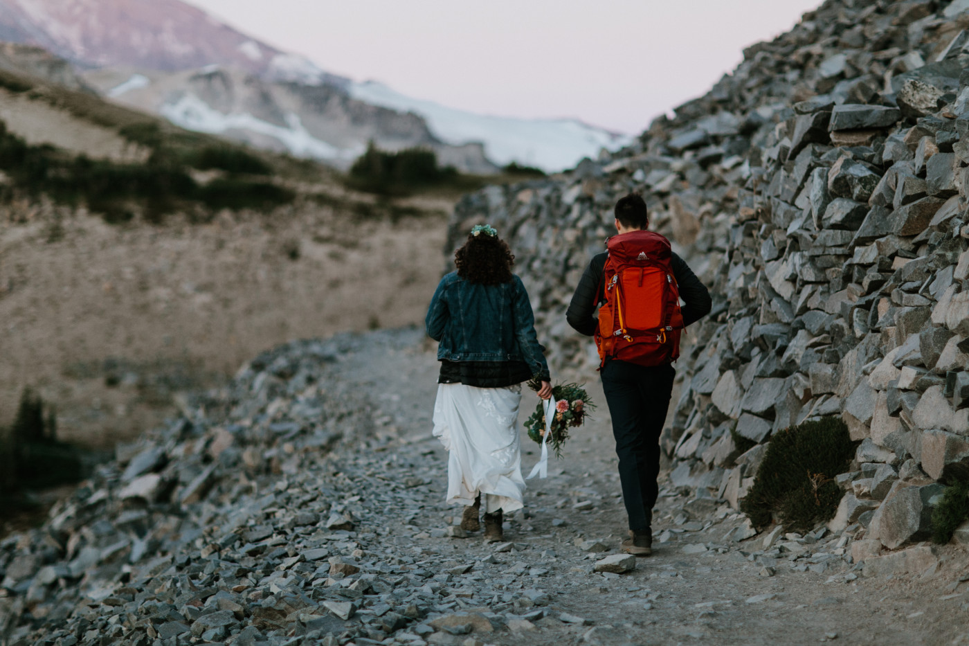 Tasha and Chad walk along the trail. Elopement photography at Mount Rainier by Sienna Plus Josh.