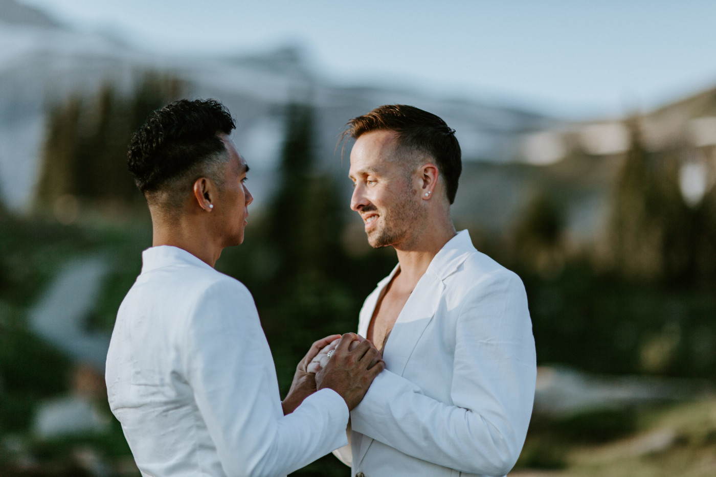 Brooks and Fred stand together in front of Mount Rainier.