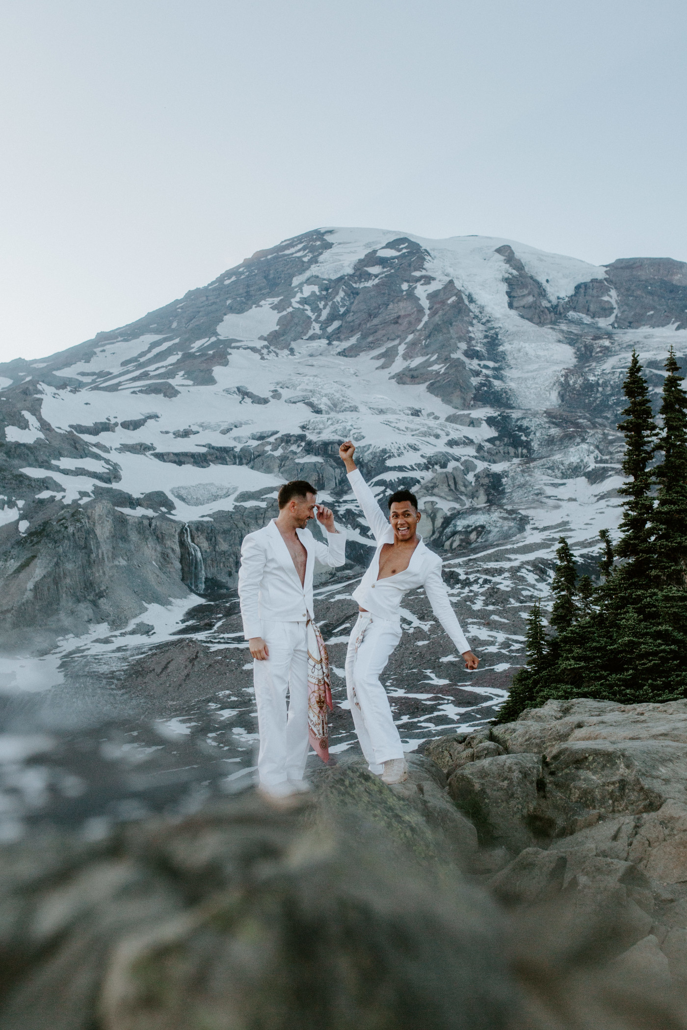 Brooks and Fred celebrate after their elopement in Mount Rainier, Washington.