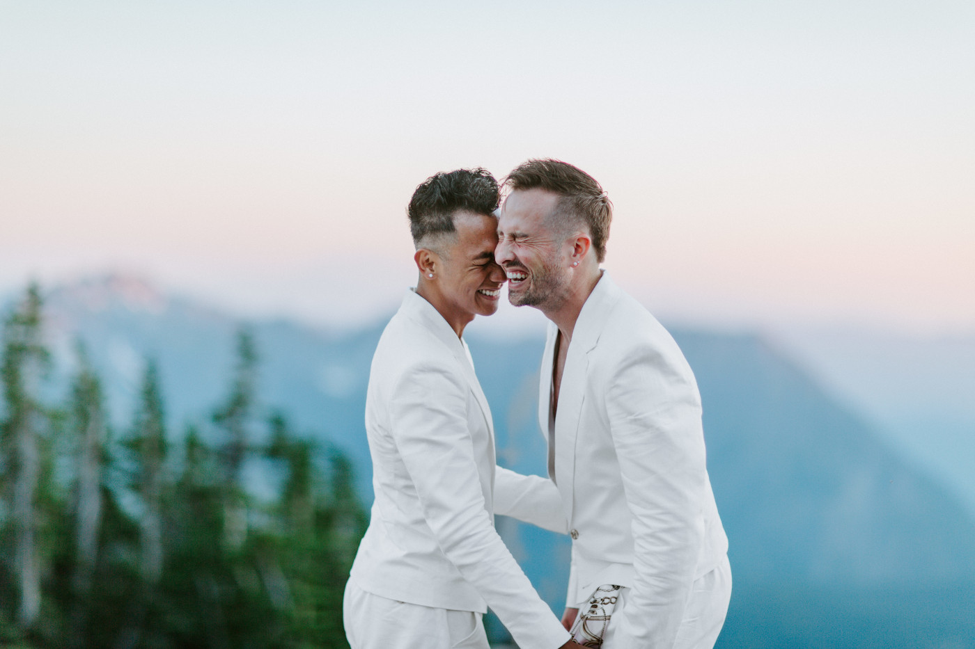 Brooks and Fred laugh after their elopement ceremony in Mount Rainier.