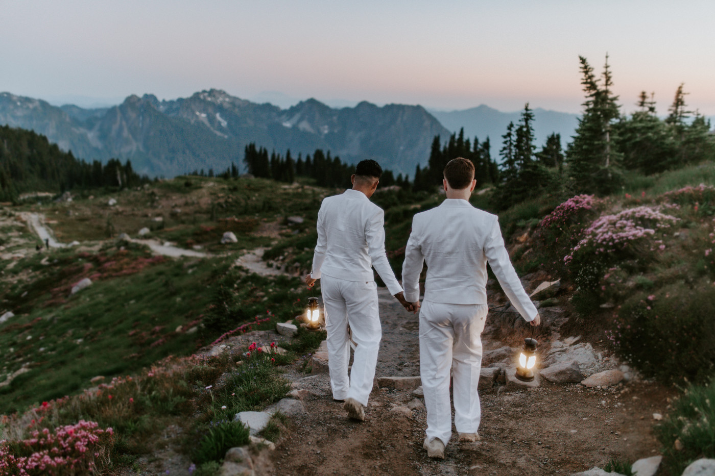 Fred and Brooks walk with latnerns in Mount Rainier.
