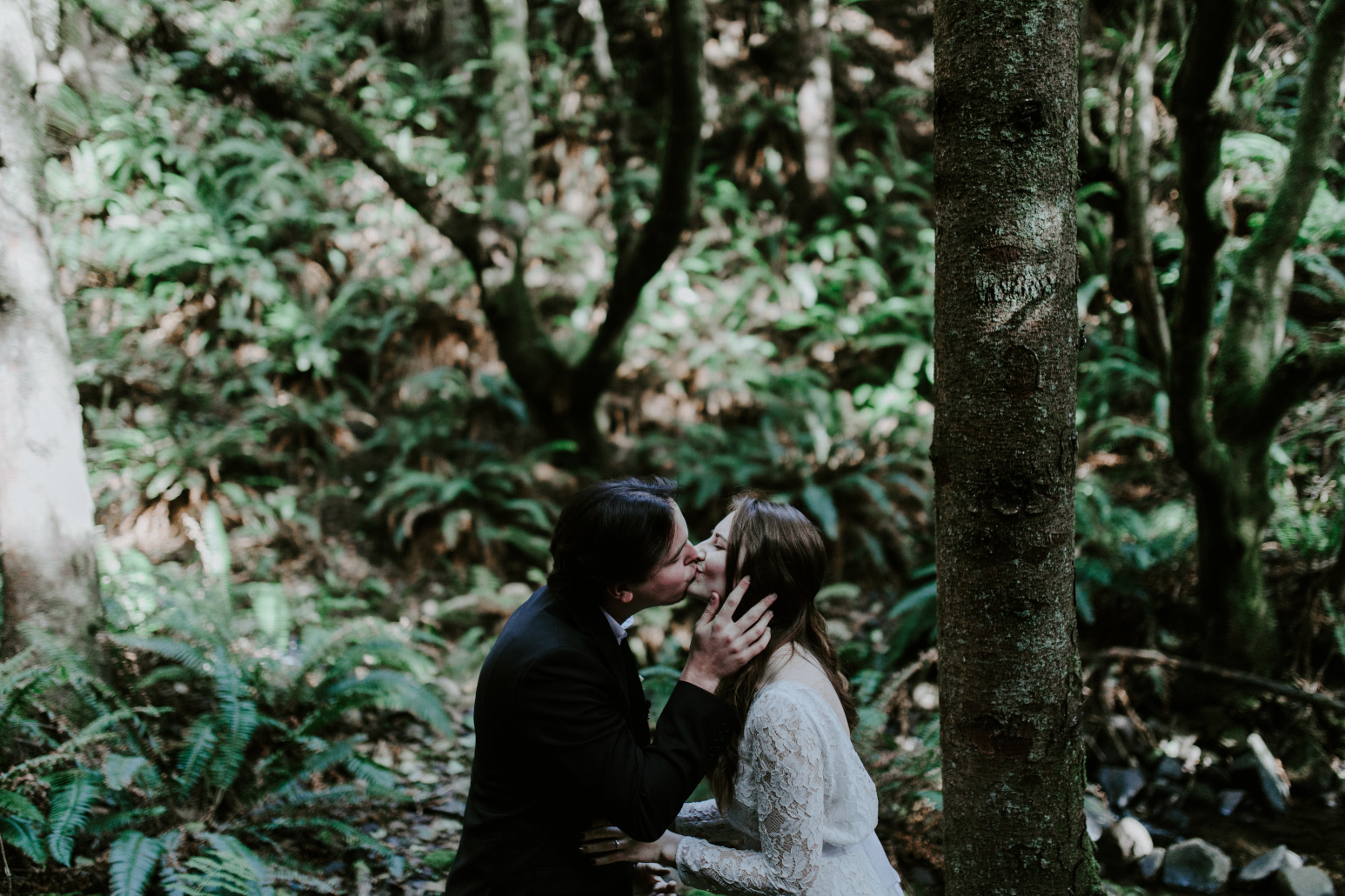 Nicole and Vlad kiss. Elopement wedding photography at Cannon Beach by Sienna Plus Josh.