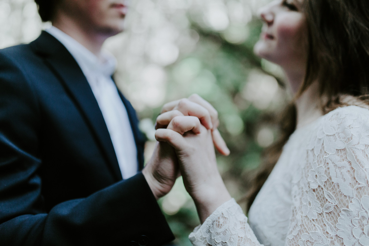 Nicole holds on to Vlad's hand. Elopement wedding photography at Cannon Beach by Sienna Plus Josh.