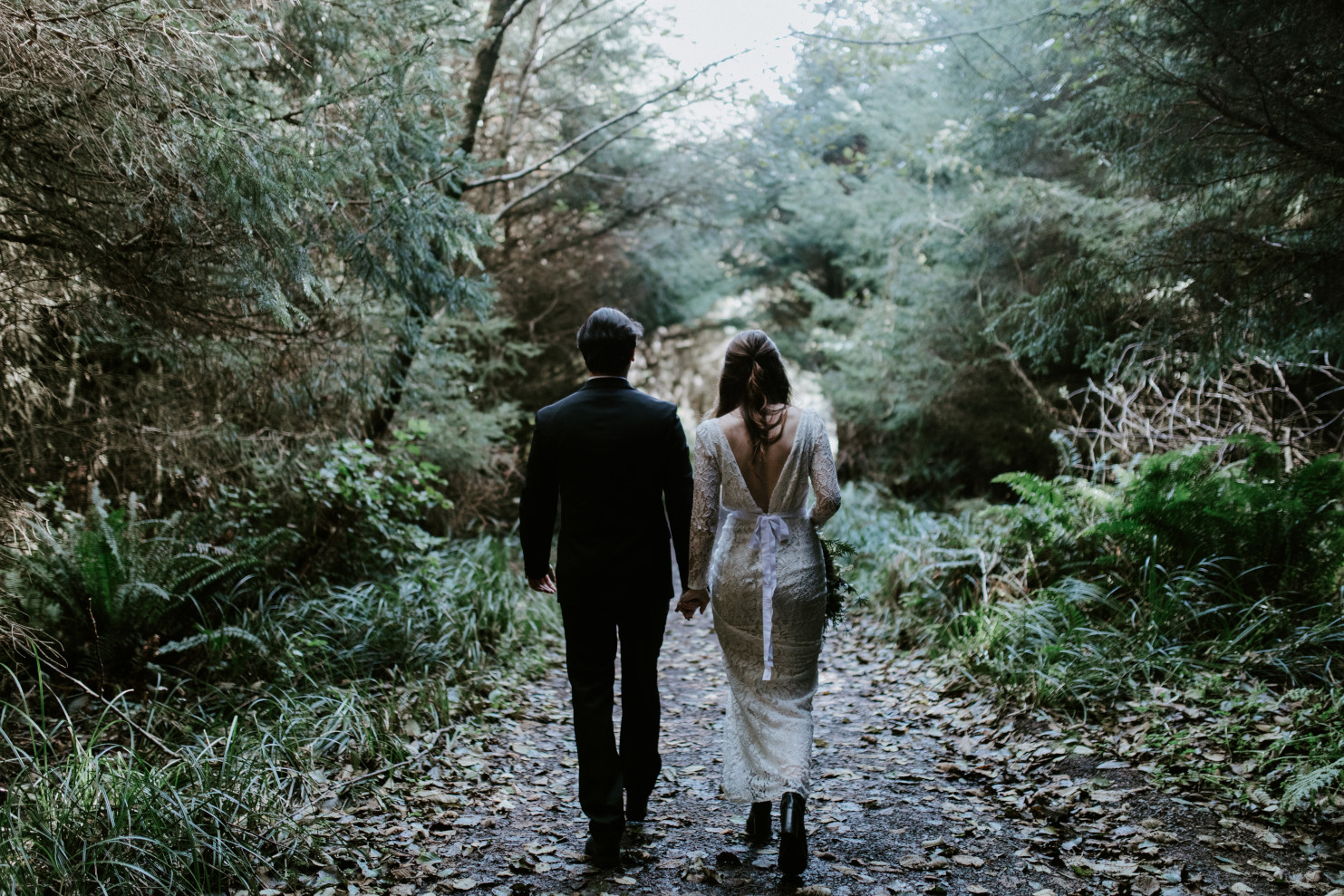Nicole and Vlad hike back toward the trailhead. Elopement wedding photography at Cannon Beach by Sienna Plus Josh.