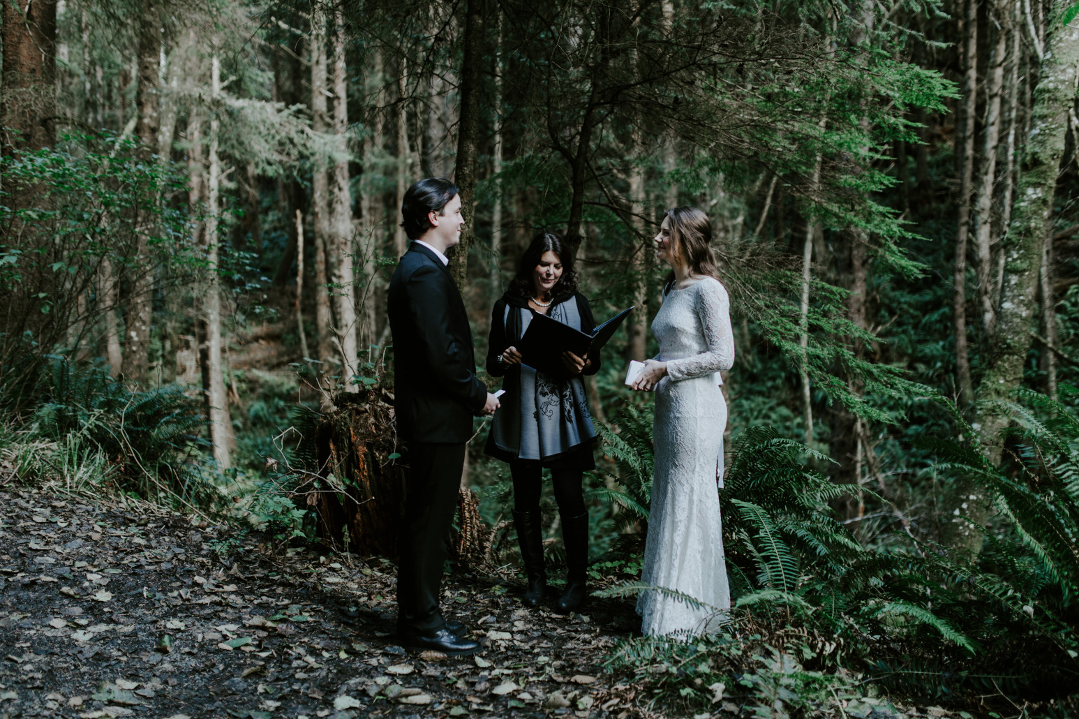 Nicole and Vlad stand during their elopement ceremony. Elopement wedding photography at Cannon Beach by Sienna Plus Josh.