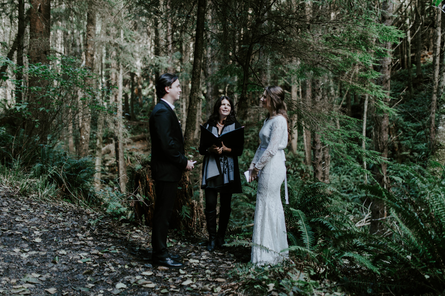 Nicole and Vlad during their wedding ceremony at Cannon Beach. Elopement wedding photography at Cannon Beach by Sienna Plus Josh.