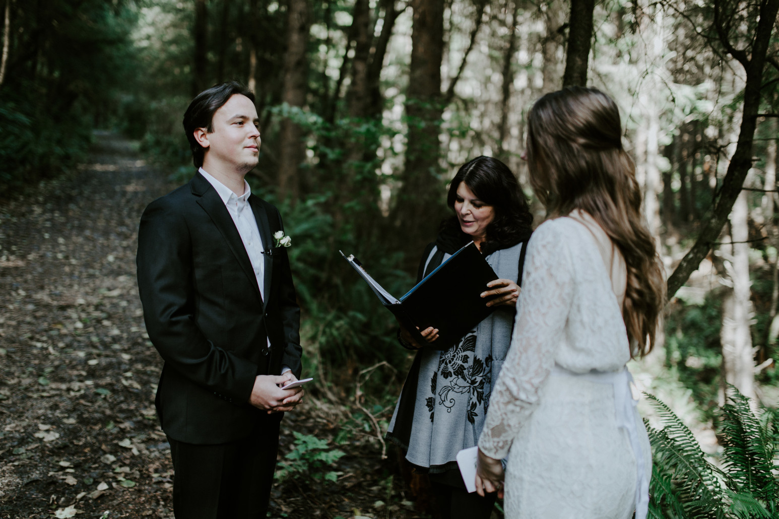 Nicole and Vlad exchange vows during their elopement at Cannon Beach. Elopement wedding photography at Cannon Beach by Sienna Plus Josh.