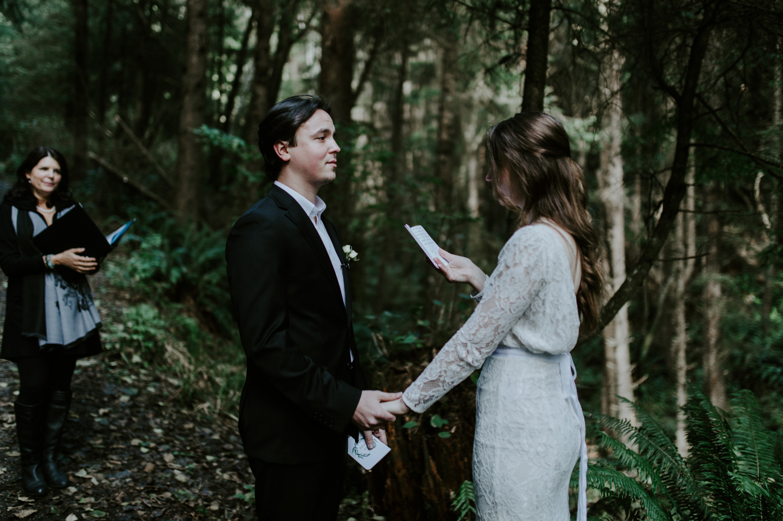 Nicole reads her vows to Vlad during their elopement. Elopement wedding photography at Cannon Beach by Sienna Plus Josh.