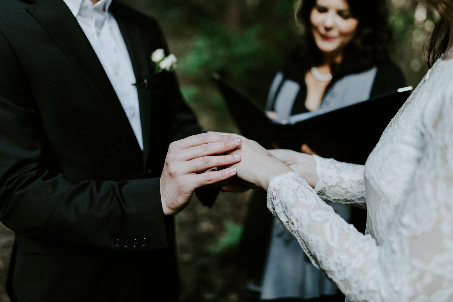 Nicole and Vlad exchange rings. Elopement wedding photography at Cannon Beach by Sienna Plus Josh.