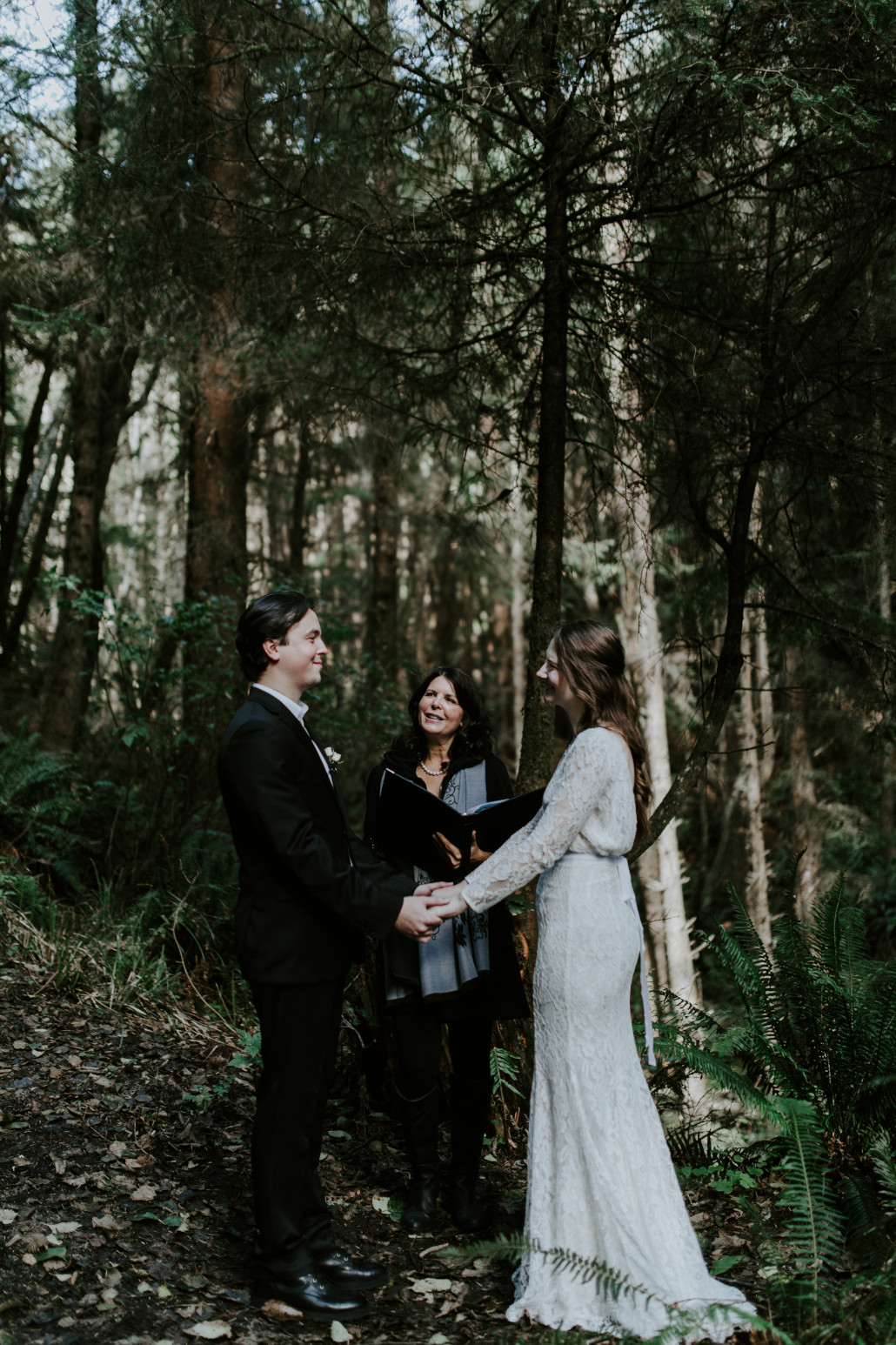 Nicole and Vlad pledge their love for each other at Cannon Beach. Elopement wedding photography at Cannon Beach by Sienna Plus Josh.